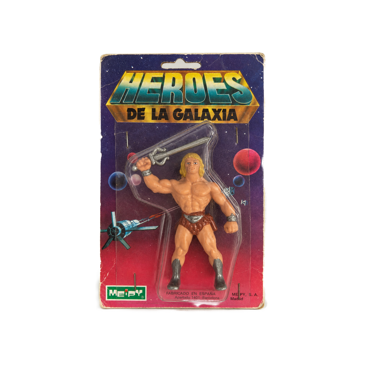 A vintage Meepay action figure of He-Man from 'Heroes de la Galaxia' in its original blister card packaging, shown against a plain white background.