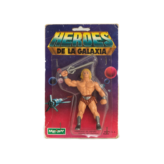 A vintage Meepay action figure of He-Man from 'Heroes de la Galaxia' in its original blister card packaging, shown against a plain white background.